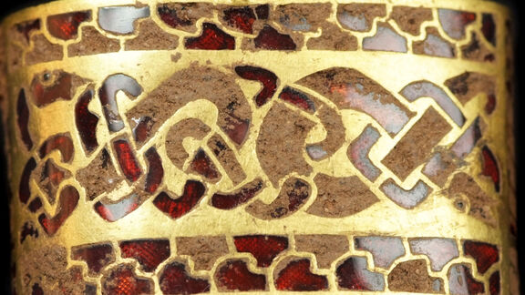 Puzzlopedia | Puzzle Gold sword hilt fitting with cloisonné garnet